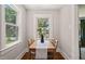Bright dining room featuring a light wood table, seating for four, and an abundance of natural light at 1022 Carolina Ave, Durham, NC 27705
