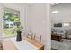 Bright dining area featuring hardwood floors, view of the front yard, and access to the living room at 1022 Carolina Ave, Durham, NC 27705