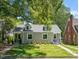 Charming grey home featuring a well-manicured lawn and dormer windows at 1022 Carolina Ave, Durham, NC 27705