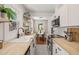 Well-lit modern kitchen featuring butcher block countertops, stainless steel appliances, and tile flooring at 1022 Carolina Ave, Durham, NC 27705
