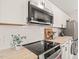 Well-appointed kitchen featuring butcher block countertops, stainless steel appliances, and subway tile backsplash at 1022 Carolina Ave, Durham, NC 27705