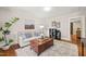 Comfortable living room featuring hardwood floors, neutral tones, and a stylish coffee table at 1022 Carolina Ave, Durham, NC 27705