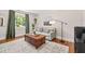 Bright living room featuring hardwood floors, neutral tones, and a stylish coffee table at 1022 Carolina Ave, Durham, NC 27705