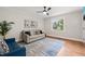 Comfortable living room with hardwood floors and bright window showcasing the neighborhood at 1022 Carolina Ave, Durham, NC 27705