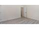 This bedroom boasts neutral walls, stylish light-colored wood flooring, and a bright, open feel at 103 Equestrian Ct, Cary, NC 27513