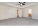 Unfurnished bedroom with carpet, natural light and two entry doors to other areas of the home at 103 Equestrian Ct, Cary, NC 27513