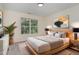 Tastefully decorated bedroom with large window providing lots of natural light at 103 Equestrian Ct, Cary, NC 27513