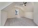 This empty bedroom has neutral carpet and walls, a window for natural light, and a ceiling fan at 103 Equestrian Ct, Cary, NC 27513