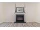 Classic fireplace featuring a dark hearth and a decorative mirror above, providing a cozy focal point in the living space at 103 Equestrian Ct, Cary, NC 27513