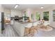 This gorgeous eat-in kitchen is well lit and features an island, countertops, and a breakfast nook at 103 Equestrian Ct, Cary, NC 27513