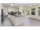 Bright kitchen features granite countertops, white cabinetry, and a spacious center island, ideal for cooking and entertaining at 103 Equestrian Ct, Cary, NC 27513