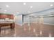Expansive basement with stained concrete floors, recessed lighting, and kitchenette with wooden cabinets at 107 Sonoma Valley Dr, Cary, NC 27518