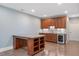 Finished basement with a wet bar, granite counters, and cabinets at 107 Sonoma Valley Dr, Cary, NC 27518