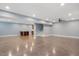 Open concept finished basement area with wet bar and stairway at 107 Sonoma Valley Dr, Cary, NC 27518
