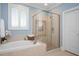Bathroom featuring a glass shower and soaking tub at 107 Sonoma Valley Dr, Cary, NC 27518