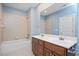Bright bathroom with a double sink vanity, tub and tile surround at 107 Sonoma Valley Dr, Cary, NC 27518