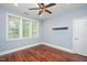 Light-filled bedroom with hardwood floors and ample natural light from the windows at 107 Sonoma Valley Dr, Cary, NC 27518