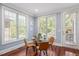 Breakfast nook featuring hardwood floors, natural light, and access to the outdoors at 107 Sonoma Valley Dr, Cary, NC 27518