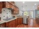 Well-equipped kitchen with stainless steel appliances and granite countertops at 107 Sonoma Valley Dr, Cary, NC 27518