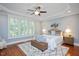 Main bedroom boasts a ceiling fan, tray ceiling, and great natural light at 107 Sonoma Valley Dr, Cary, NC 27518