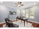 Office with hardwood floors, shuttered windows, ceiling fan, and a neutral color palette at 107 Sonoma Valley Dr, Cary, NC 27518