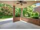 Charming patio area with brick pillars and a brick wall, overlooking the landscaped backyard at 107 Sonoma Valley Dr, Cary, NC 27518