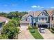 Aerial view of a lovely home with a two-car garage, attractive landscaping, and a well-maintained driveway at 108 Ribbon Walk Ln, Holly Springs, NC 27540