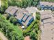 Birds eye view of a well-manicured residential neighborhood offering lush greenery and landscaped yards, providing a serene setting at 108 Ribbon Walk Ln, Holly Springs, NC 27540