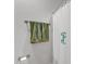 Close up of bathroom shower with shower curtain featuring an initial at 108 Ribbon Walk Ln, Holly Springs, NC 27540