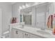 Bathroom featuring double sinks and a large mirror at 108 Ribbon Walk Ln, Holly Springs, NC 27540