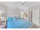 Bright bedroom with large window and ceiling fan at 108 Ribbon Walk Ln, Holly Springs, NC 27540