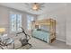 Bedroom features bunk bed and exercise bike, and shuttered windows at 108 Ribbon Walk Ln, Holly Springs, NC 27540