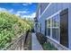 Exterior view features walkway, fence, blue siding, and black shutters at 108 Ribbon Walk Ln, Holly Springs, NC 27540