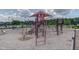 Community playground area with slides, climbing structures, and a shaded canopy at 108 Ribbon Walk Ln, Holly Springs, NC 27540