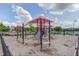 Community playground featuring slides, climbing equipment, and overhead canopy with nearby houses at 108 Ribbon Walk Ln, Holly Springs, NC 27540