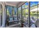 Bright and airy sunroom featuring large windows, comfortable seating, and stylish décor for relaxing and entertaining at 108 Ribbon Walk Ln, Holly Springs, NC 27540