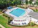 Aerial view of a large community swimming pool with many lounge chairs at 108 Ribbon Walk Ln, Holly Springs, NC 27540