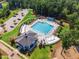 Aerial photo of a large community swimming pool and clubhouse at 108 Ribbon Walk Ln, Holly Springs, NC 27540