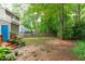 Expansive backyard with mature trees, providing a private and tranquil setting for outdoor activities and relaxation at 112 Barcelona Ct, Cary, NC 27513