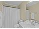 Neutral bathroom with a white shower curtain and a light vanity at 112 Barcelona Ct, Cary, NC 27513