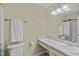 Neutral bathroom with a large mirror and a white shower curtain at 112 Barcelona Ct, Cary, NC 27513