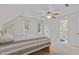 Cozy bedroom featuring neutral colors, a ceiling fan, and two windows for ample natural light at 112 Barcelona Ct, Cary, NC 27513