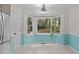Bright breakfast nook featuring a bay window, lovely natural light, and an adjacent deck at 112 Barcelona Ct, Cary, NC 27513