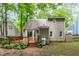 Rear exterior view showcasing the home's architecture, complemented by a deck and a well-maintained backyard at 112 Barcelona Ct, Cary, NC 27513