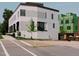 Modern, three-story building with white brick and black-trimmed windows on a sunny day at 1311 Chamblee Hill Ct, Raleigh, NC 27608