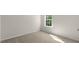 Bright bedroom featuring neutral carpeting and a large window providing natural light at 137 Pisgah St, Sanford, NC 27330