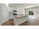 Modern kitchen featuring a center island, granite countertops, and stainless steel appliances at 137 Pisgah St, Sanford, NC 27330