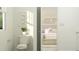 Bathroom featuring a white toilet and a doorway view into a bedroom at 144 Digging Time Ave, Princeton, NC 27569