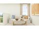 Cozy living room showcasing a comfortable sofa, large window with natural light, and stylish decor at 144 Digging Time Ave, Princeton, NC 27569