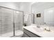 Bright bathroom featuring a glass shower, white vanity, and modern fixtures at 149 Ivory Ln, Raleigh, NC 27610